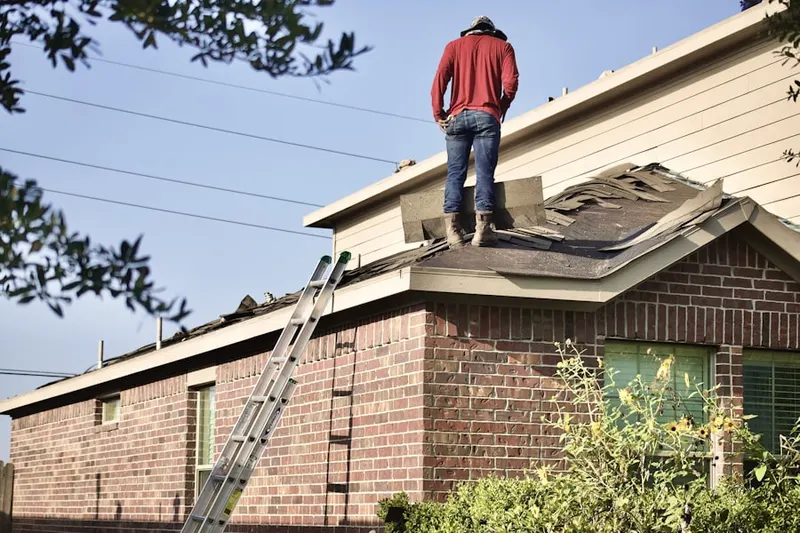 Professional roofer working on a residential roof in North Chicago
